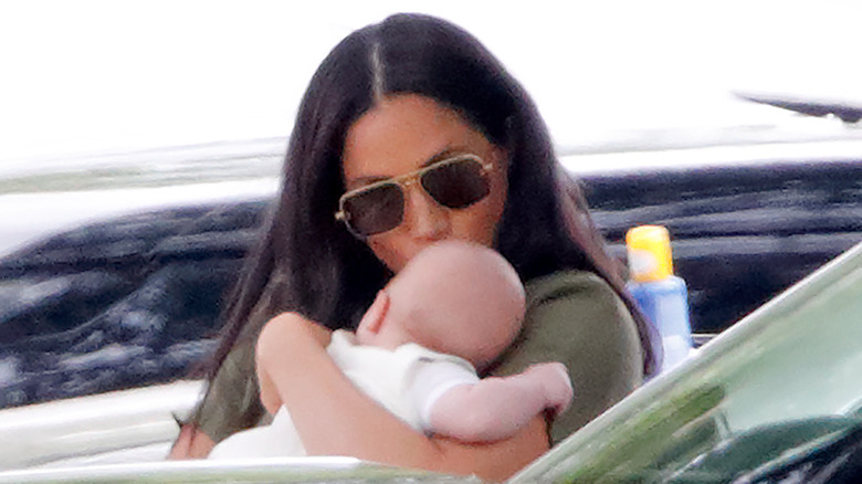 Meghan Markle kisses Archie's head