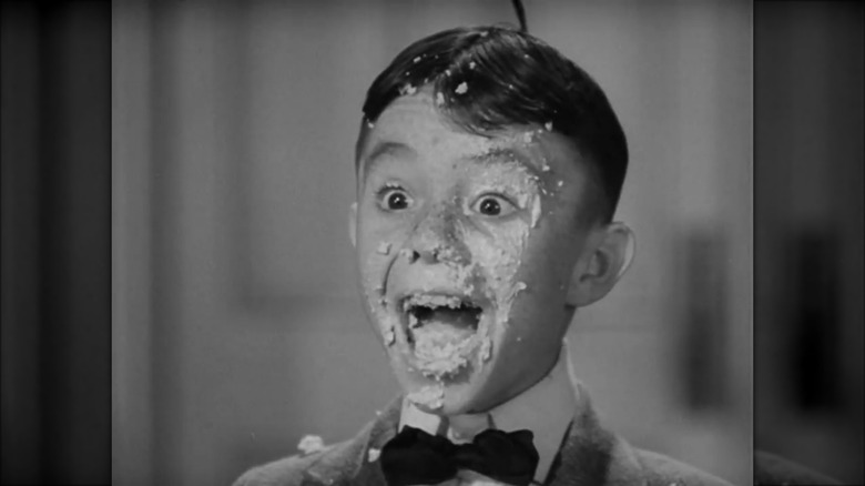 Carl Switzer covered in cake