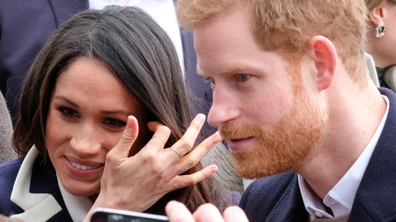 Prince Harry and Meghan talking