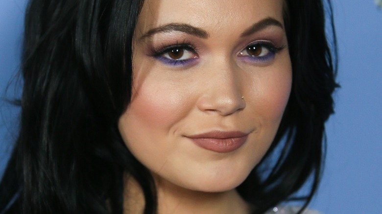 A closeup of Kelli Berglund black hair purple eyeshadow