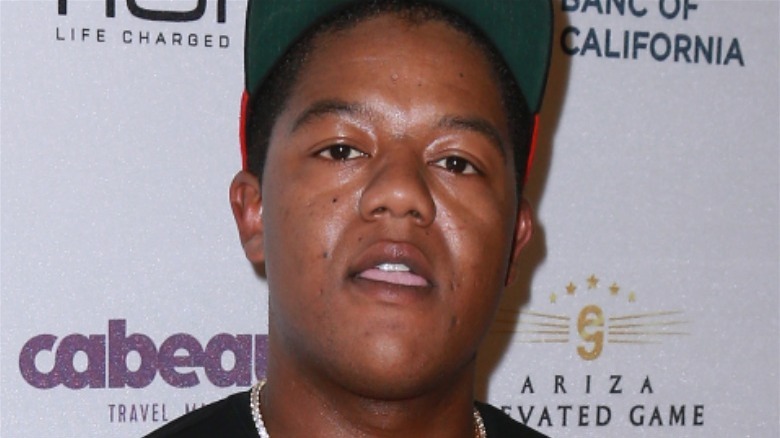 A closeup of Kyle Massey mouth open hat