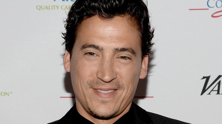 Andrew Keegan on red carpet smiling 