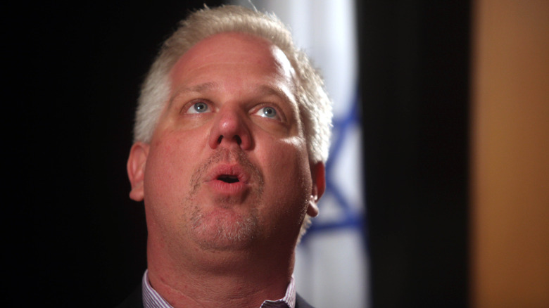 Glenn Beck speaking while looking up