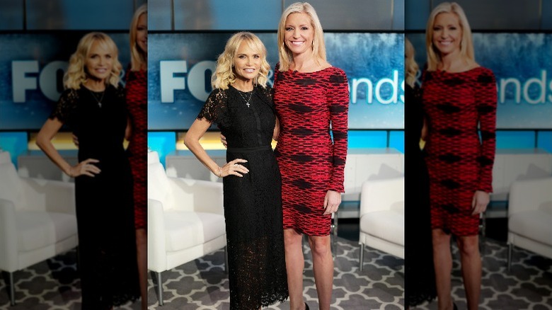 Kristin Chenoweth and Ainsley Earhardt pose together on the set of "Fox and Friends" (2019)