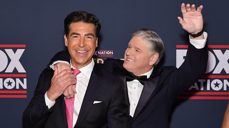 Jesse Watters and Sean Hannity posing with huge smiles