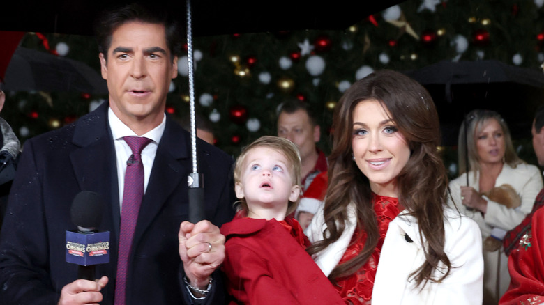 Jesse Watters and Emma DiGiovine under an umbrella