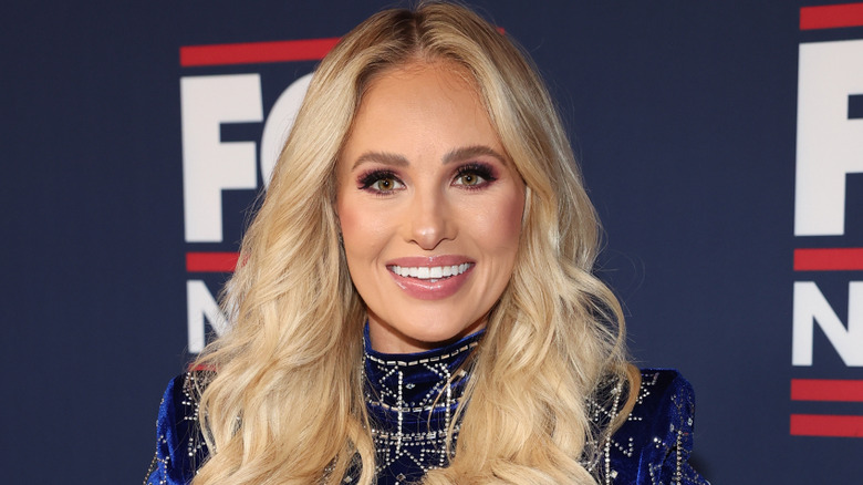 Tomi Lahren smiling on the red carpet