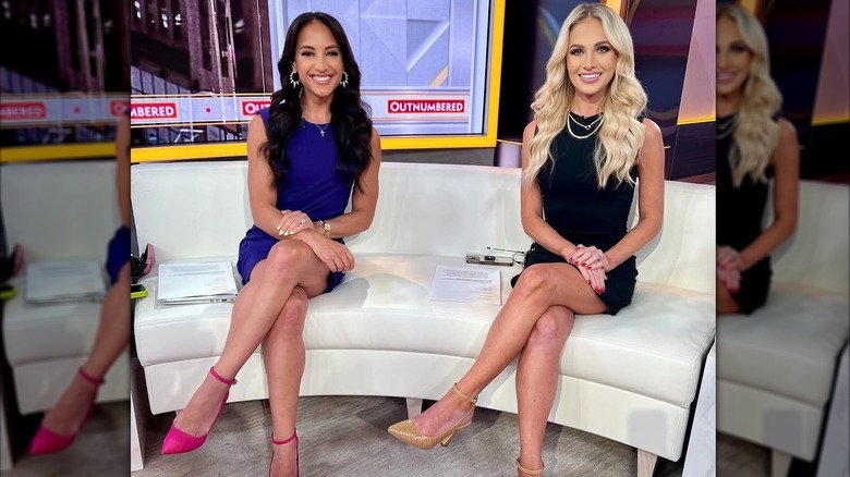 Tomi Lahren and Emily Compagno posing on a couch