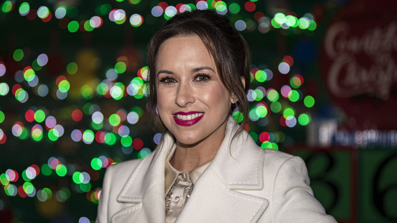 Lacey Chabert outside in front of Christmas lights