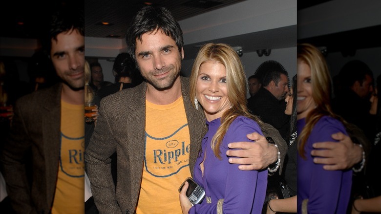 John Stamos with arm around Lori Loughlin