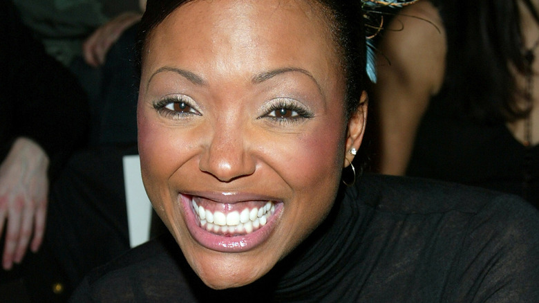 Aisha Tyler smiling wide