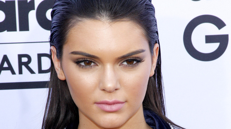 Kendall Jenner with her hair slicked back