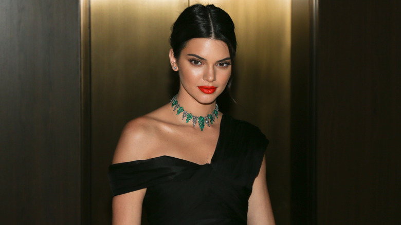 Kendall Jenner wearing an off the shoulder dress