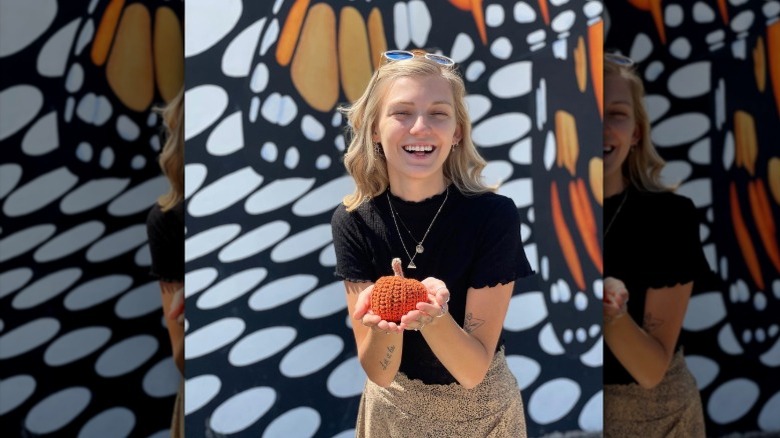 Gabby Petito holding crochet pumpkin