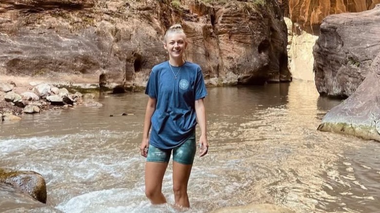 Gabby Petito standing in the narrows of Zion National Park (2021)