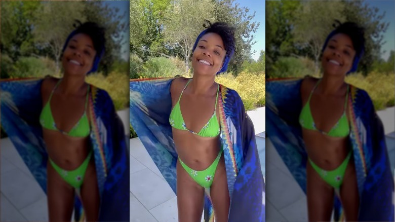 Gabrielle Union smiling in neon bikini