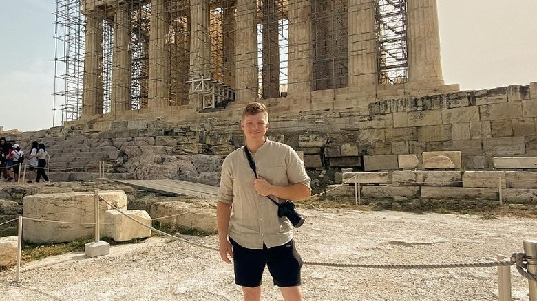 Garrison Brown standing in front of columns