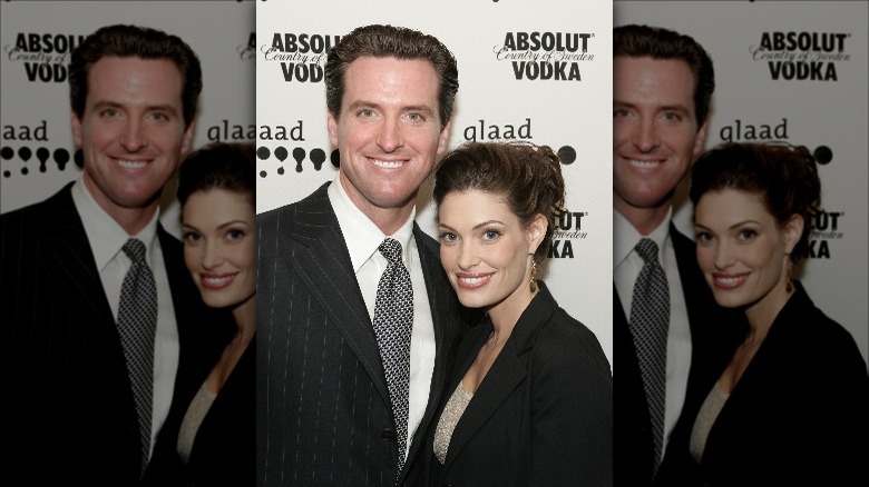 Gavin Newsom and Kimberly Guilfoyle smiling at event