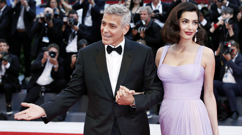 George Clooney with Amal Clooney on the red carpet