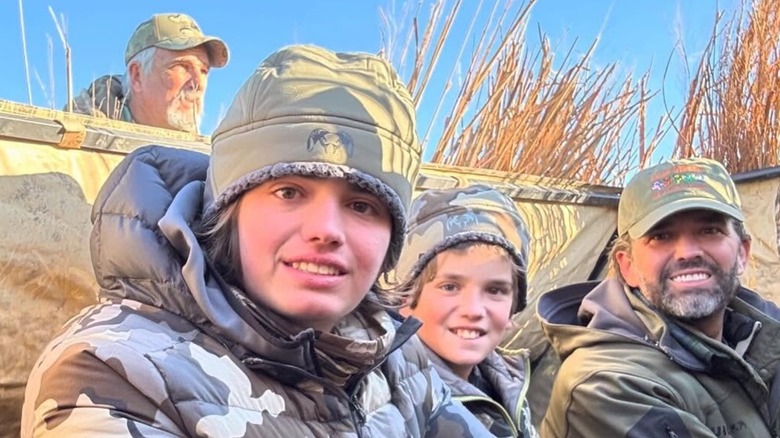 Donald John Trump III and his family smiling at the Trumps' annual boys' hunt