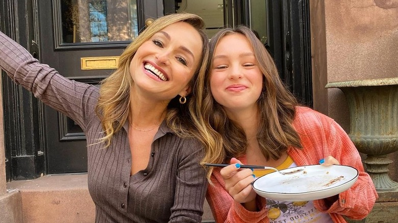 Giada De Laurentiis and Jade De Laurentiis smiling with empty plate