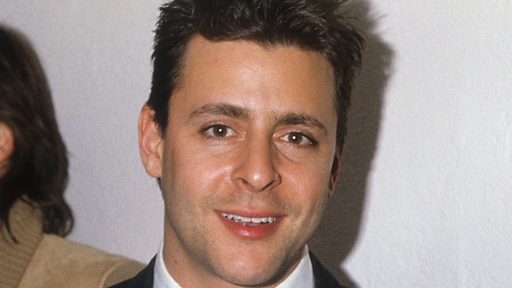 young Judd Nelson smiling