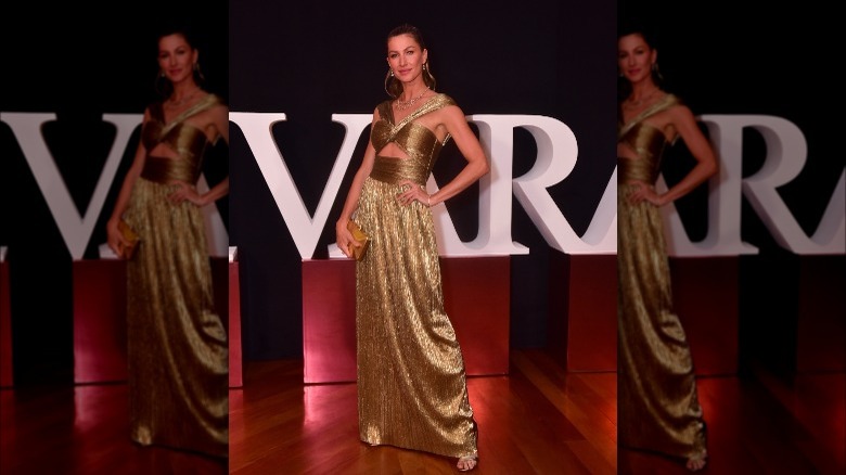 Gisele Bündchen in a gold dress