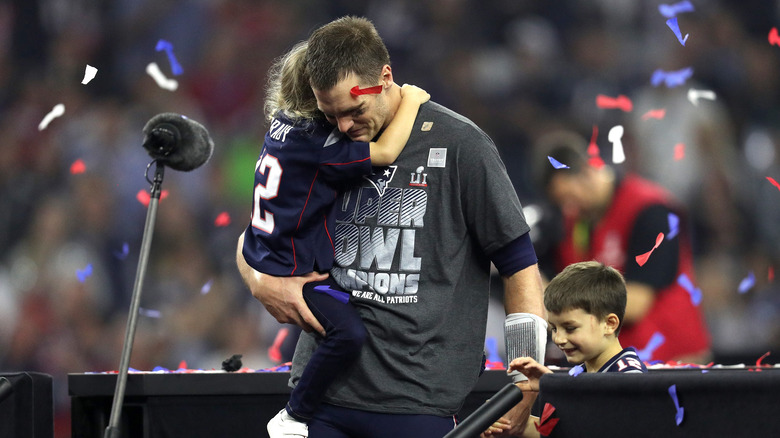 Tom Brady celebrating with his children after defeating the Atlanta Falcons during Super Bowl 51