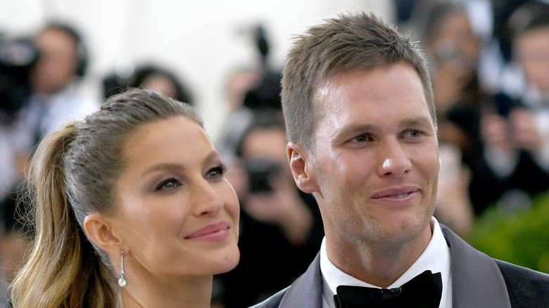 Tom Brady and Gisele Bundchen at an event 