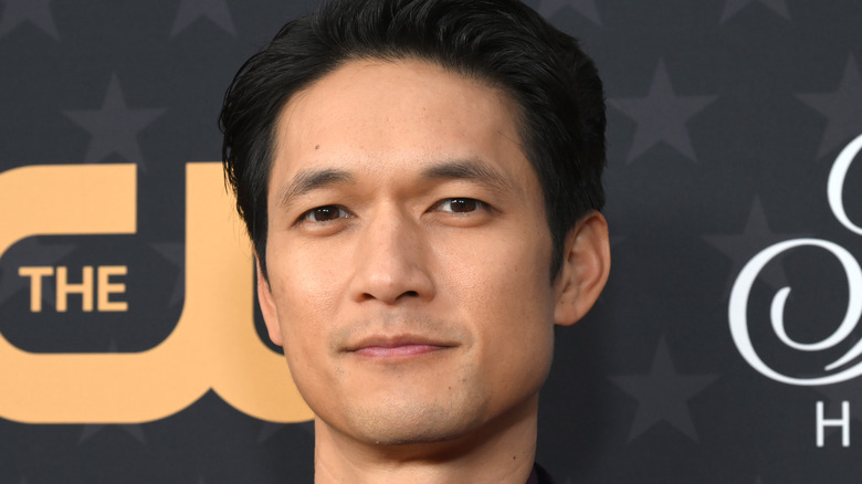 Harry Shum Jr. black hair 5 o'clock shadow closed mouth smile