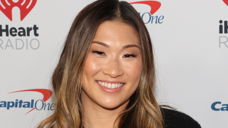 Jenna Ushkowitz long brown hair wide smile 