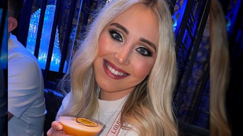 Megan Ramsay smiling with cocktail