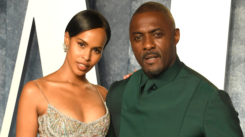 Idris Elba and Sabrina Dhowre posing for pictures