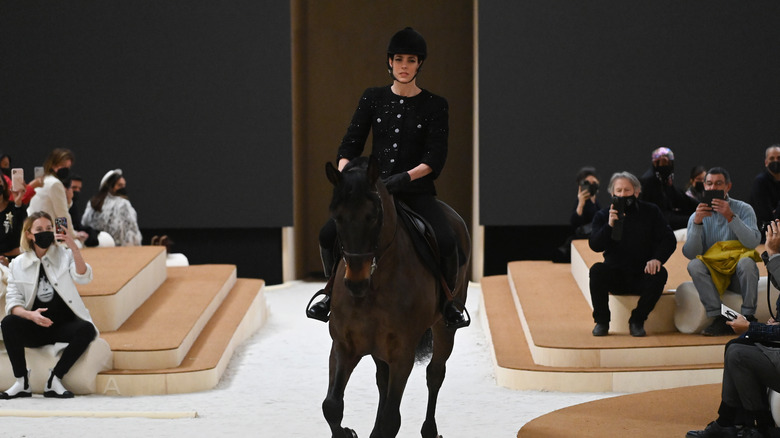 Charlotte Casiraghi riding a horse on Chanel runway