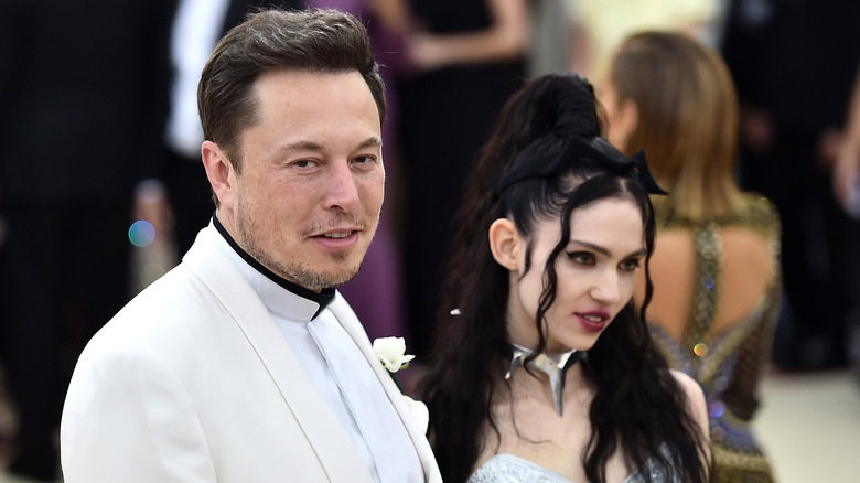 Grimes and Elon Musk posing at the Met Gala