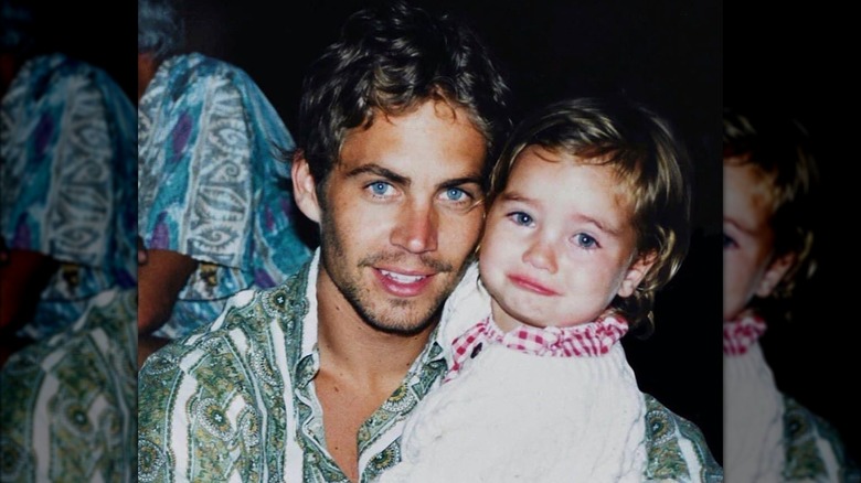 A young Meadow Walker posing with her father Paul Walker