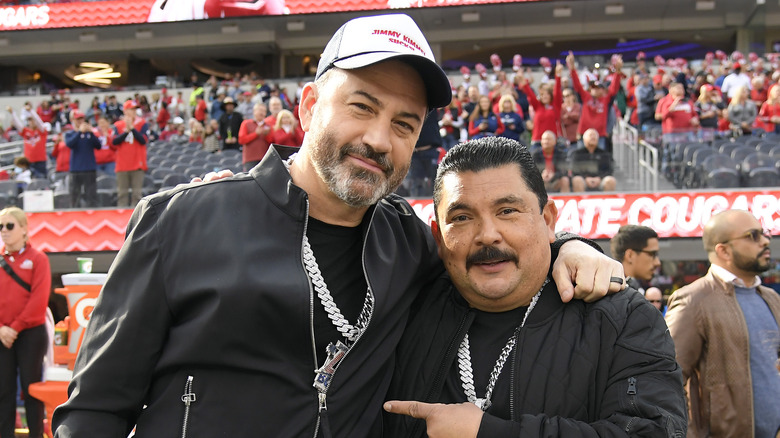 Jimmy Kimmel with Guillermo Rodriguez at a stadium