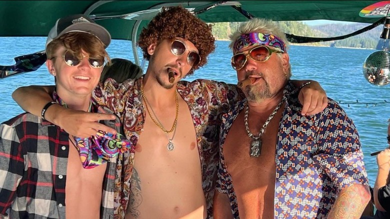 Guy Fieri with his kids near water