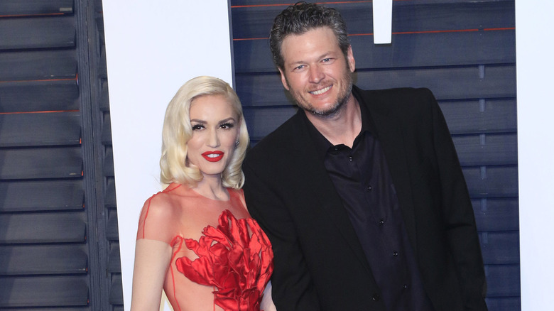 Gwen Stefani and Blake Shelton on the red carpet at the at the 2016 Vanity Fair Oscar Party