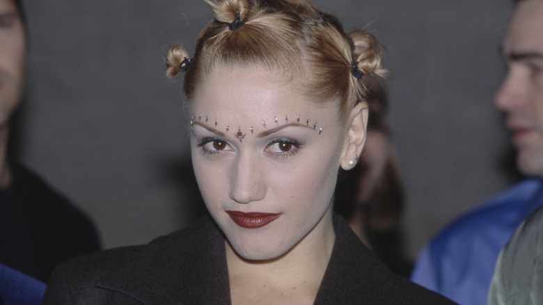 Gwen Stefani posing with glitter on her eyebrows and a bindi