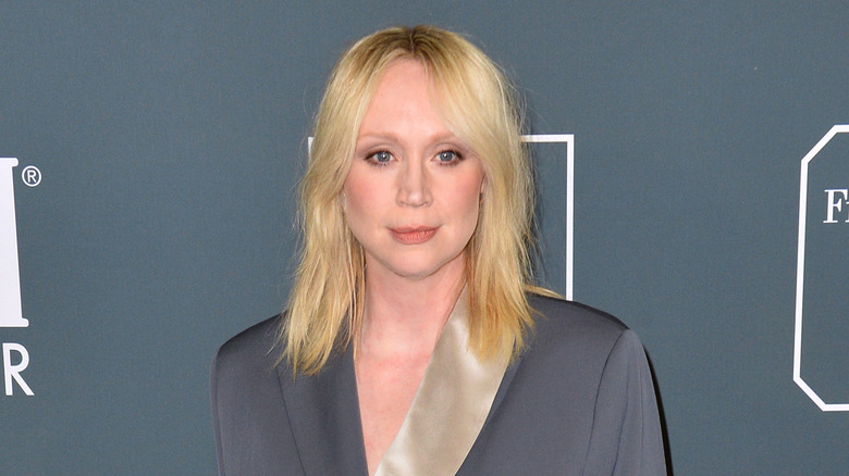 Gwendoline Christie in grey suit