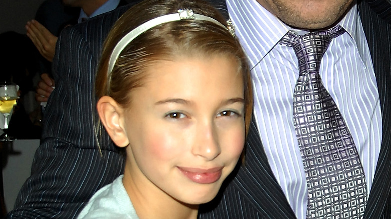 Hailey Bieber wearing a headband, smiling