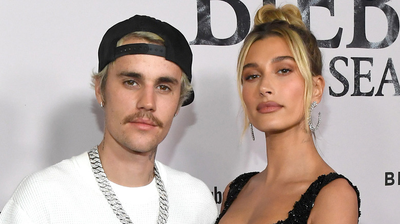 Justin Bieber and Hailey Bieber, both posing