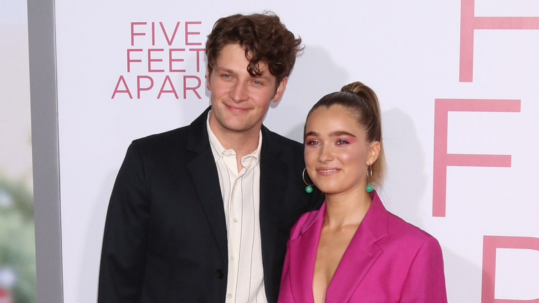 Haley Lu Richardson and Brett Dier posing