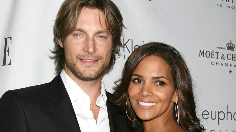 Gabriel Aubry holding a smiling Halle Berry