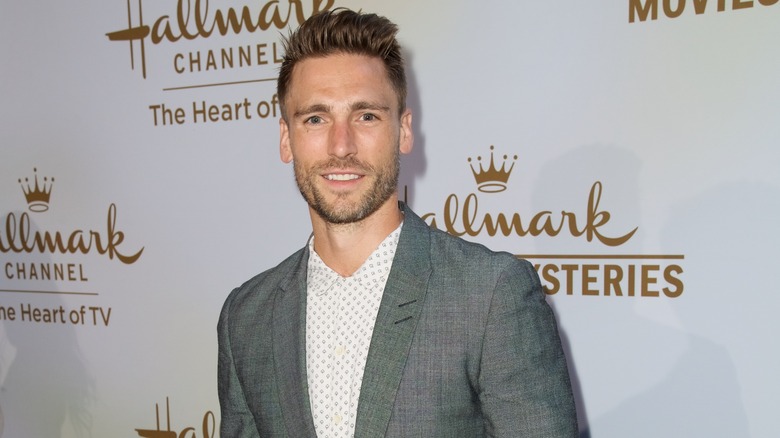 Andrew Walker posing in gray