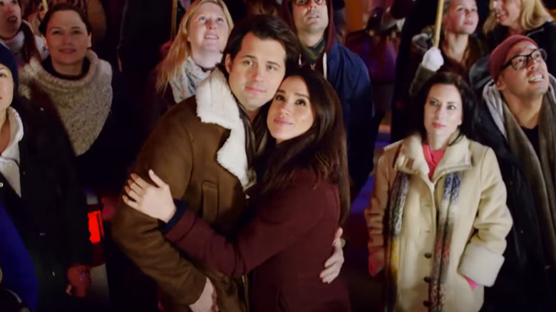 Kristoffer Polaha embracing Meghan Markle