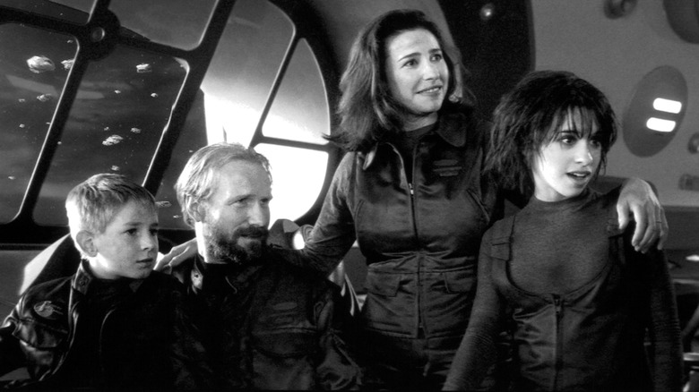 Lacey Chabert and the cast of Lost in Space in a scene from the film