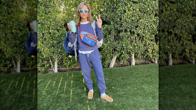 Nikki DeLoach carrying multiple bags