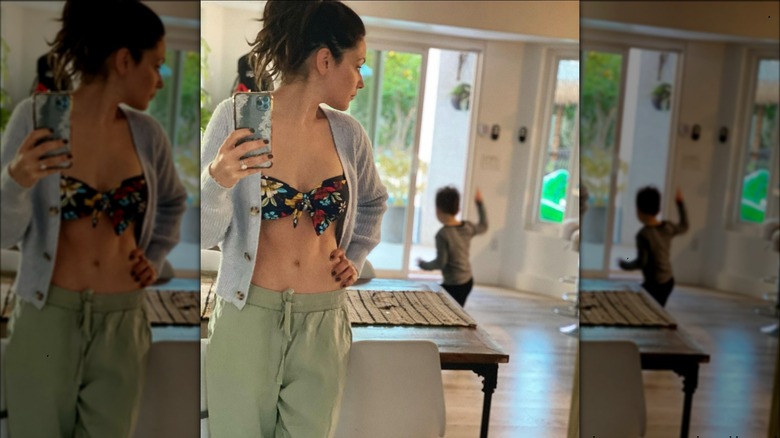 Italia Ricci taking mirror selfie